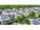 High angle aerial view showcases neighborhood houses with gray roofs, trees, and green lawns at 1513 Resolute St, Celebration, FL 34747