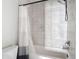 A bathroom with a tub-shower combination and a toilet; features tile walls and a shower curtain at 1513 Resolute St, Celebration, FL 34747