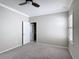 A serene bedroom features neutral walls, a window with shutters, and plush carpet at 1513 Resolute St, Celebration, FL 34747