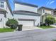 Exterior shows two-story home with driveway and lush green bushes at 1513 Resolute St, Celebration, FL 34747