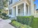Inviting front porch featuring stately white columns, fresh landscaping, and clear house number signage for easy identification at 1513 Resolute St, Celebration, FL 34747