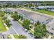 Aerial view of the townhome community showcasing lush landscaping, green spaces, and a playground at 15540 Blackbead St, Winter Garden, FL 34787