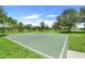 Outdoor basketball court within a green community setting and mature trees at 15540 Blackbead St, Winter Garden, FL 34787