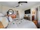 Bedroom featuring a plush bed, ceiling fan, and ensuite bathroom at 15540 Blackbead St, Winter Garden, FL 34787