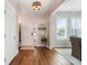 Inviting foyer with elegant flooring and natural light streaming through the windows at 15540 Blackbead St, Winter Garden, FL 34787