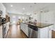 Island kitchen featuring stainless steel appliances, granite countertops and pendant lighting at 15540 Blackbead St, Winter Garden, FL 34787