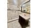 Bathroom featuring a large walk-in shower with a marble look and a modern vanity at 1720 Foxhall Cir # 1720, Kissimmee, FL 34741