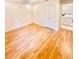 A bedroom with light hardwood floors, a double door closet and neutral-colored walls at 1720 Foxhall Cir # 1720, Kissimmee, FL 34741