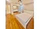Bedroom featuring hardwood floors, a mirror closet, and modern lighting at 1720 Foxhall Cir # 1720, Kissimmee, FL 34741