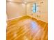 Bedroom featuring wooden floors and natural light, creating a cozy atmosphere at 1720 Foxhall Cir # 1720, Kissimmee, FL 34741
