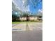 A two story residential building featuring private parking spots and staircases leading to each unit at 1720 Foxhall Cir # 1720, Kissimmee, FL 34741