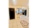 Well-lit kitchen with tile floors, modern appliances, and black countertops at 1720 Foxhall Cir # 1720, Kissimmee, FL 34741