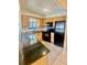 Kitchen featuring modern black appliances, light wood cabinets, and dark countertops at 1720 Foxhall Cir # 1720, Kissimmee, FL 34741