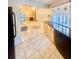Bright kitchen with dark countertops overlooking the living room at 1720 Foxhall Cir # 1720, Kissimmee, FL 34741