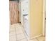 This space features a laundry area with a wooden sliding barn door for an enhanced look at 1720 Foxhall Cir # 1720, Kissimmee, FL 34741
