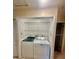 The laundry room features a stacked washer and dryer in a closet at 1720 Foxhall Cir # 1720, Kissimmee, FL 34741