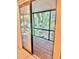 View of a screened patio featuring views of trees and plants through the screens at 1720 Foxhall Cir # 1720, Kissimmee, FL 34741
