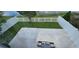 Overhead view of a fenced backyard with patio and view of the pond at 1827 Meadow Pond Way, Orlando, FL 32824