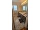 Well-lit bathroom with double sinks, decorative floors, and a large mirror at 1827 Meadow Pond Way, Orlando, FL 32824
