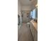 Bright bathroom with a large shower, white vanity, and marble countertops at 1827 Meadow Pond Way, Orlando, FL 32824