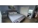 A well decorated bedroom featuring a double bed, window and night tables at 1827 Meadow Pond Way, Orlando, FL 32824
