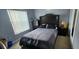 Bedroom with a double bed, window and wooden furniture at 1827 Meadow Pond Way, Orlando, FL 32824