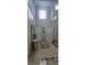 Entryway featuring decorative tile flooring, a console table, and an arched transom window above a door at 1827 Meadow Pond Way, Orlando, FL 32824