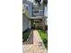 Charming tiled entryway featuring a decorative walkway with welcoming plants and outdoor decor at 1827 Meadow Pond Way, Orlando, FL 32824