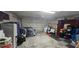 Spacious garage with storage cabinets, door, and ample room for vehicles or projects at 1827 Meadow Pond Way, Orlando, FL 32824