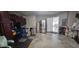 Large garage equipped with a refrigerator and cabinets, and with an interior door entrance at 1827 Meadow Pond Way, Orlando, FL 32824