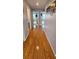 Hallway with wood floor and a view of bedrooms at 1827 Meadow Pond Way, Orlando, FL 32824