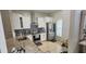 Kitchen featuring stainless steel appliances, granite countertops, and modern white cabinets at 1827 Meadow Pond Way, Orlando, FL 32824