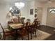 Elegant dining room with a chandelier, classic furniture, and stylish decor at 1868 Katz Crossing Dr, Kissimmee, FL 34744