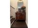 Stairway with a decorative table and mirror at 1868 Katz Crossing Dr, Kissimmee, FL 34744