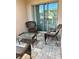 Cozy outdoor patio with wicker furniture, perfect for relaxing and enjoying the outdoors at 1868 Katz Crossing Dr, Kissimmee, FL 34744