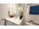 Bathroom featuring a vanity with a pristine sink, mirror, and towel and toilet at 1875 Spring Shower Cir, Kissimmee, FL 34744
