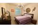 Relaxing bedroom with neutral tones, modern lighting, and a comfortable bed at 1875 Spring Shower Cir, Kissimmee, FL 34744