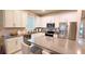 Well-equipped kitchen featuring sleek countertops, stainless steel appliances, and ample storage space at 1875 Spring Shower Cir, Kissimmee, FL 34744