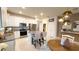 Modern kitchen with white cabinets, stainless steel appliances, and a center island with bar seating at 1875 Spring Shower Cir, Kissimmee, FL 34744