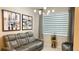 Relaxing living room with leather seating, unique artwork, and ambient lighting at 1875 Spring Shower Cir, Kissimmee, FL 34744
