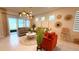 Bright, open floor plan featuring dining, living, and kitchen areas perfect for entertaining with modern pendant lighting at 1875 Spring Shower Cir, Kissimmee, FL 34744