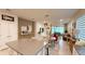 Bright, open floor plan featuring dining, living, and kitchen areas perfect for entertaining with modern pendant lighting at 1875 Spring Shower Cir, Kissimmee, FL 34744