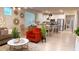 Bright, open floor plan featuring dining, living, and kitchen areas perfect for entertaining with modern pendant lighting at 1875 Spring Shower Cir, Kissimmee, FL 34744