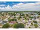 Aerial view showcasing a residential neighborhood with well-maintained homes and mature trees at 1912 Maury Rd, St Cloud, FL 34771