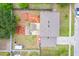 Aerial view showcasing the property's backyard, including a gazebo, firepit area, and lush landscaping at 1912 Maury Rd, St Cloud, FL 34771