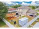 Expansive backyard features a gazebo, play set, fire pit, basketball hoop, and a privacy fence at 1912 Maury Rd, St Cloud, FL 34771