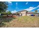 Expansive backyard features a gazebo, swing set, outdoor seating, and well-maintained lawn at 1912 Maury Rd, St Cloud, FL 34771