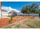 Spacious backyard featuring a gazebo, swing set, and landscaped areas, ideal for outdoor enjoyment at 1912 Maury Rd, St Cloud, FL 34771