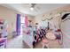 bedroom featuring unicorn themed decor and a bright window at 1912 Maury Rd, St Cloud, FL 34771