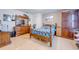 Bedroom featuring wood furniture, neutral walls, and tile floors at 1912 Maury Rd, St Cloud, FL 34771